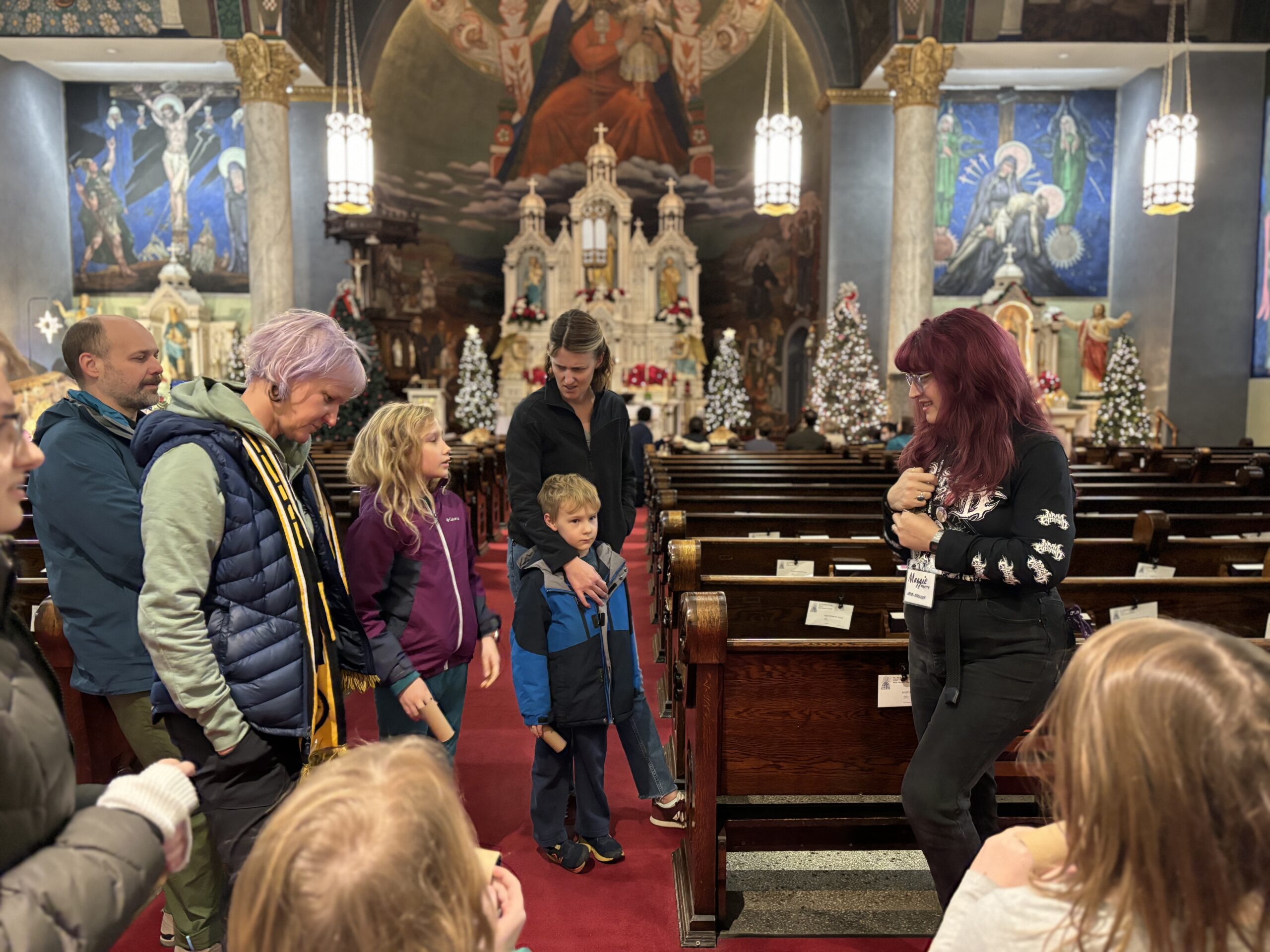 A Vanka Educator talks with a family during a Holiday Family Program.