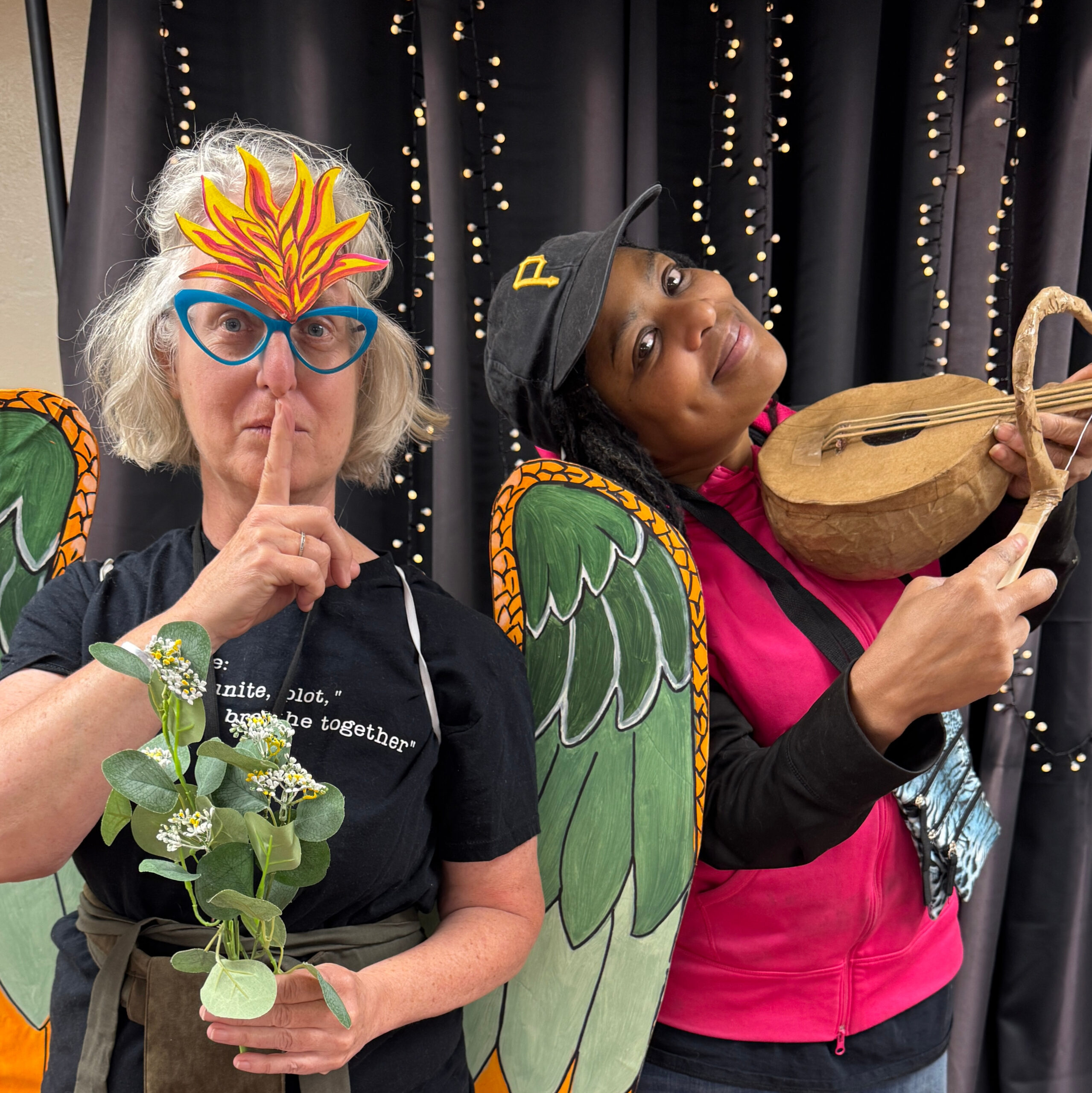 vanka-block-party-2026-photo-booth-1 Two people dressed up in Vanka murals costumes